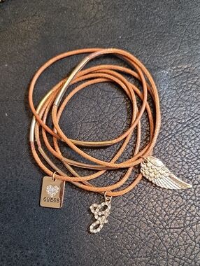 GUESS Tan MultFaux Leather Stack Bracelets with Goldtone/Crystal Charms.  * 6 *